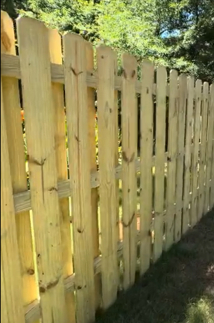 Newly installed wooden fence by Gutter Bro